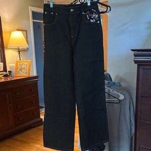 Black Jeans with Cherry Blossom Embroidered Detail.